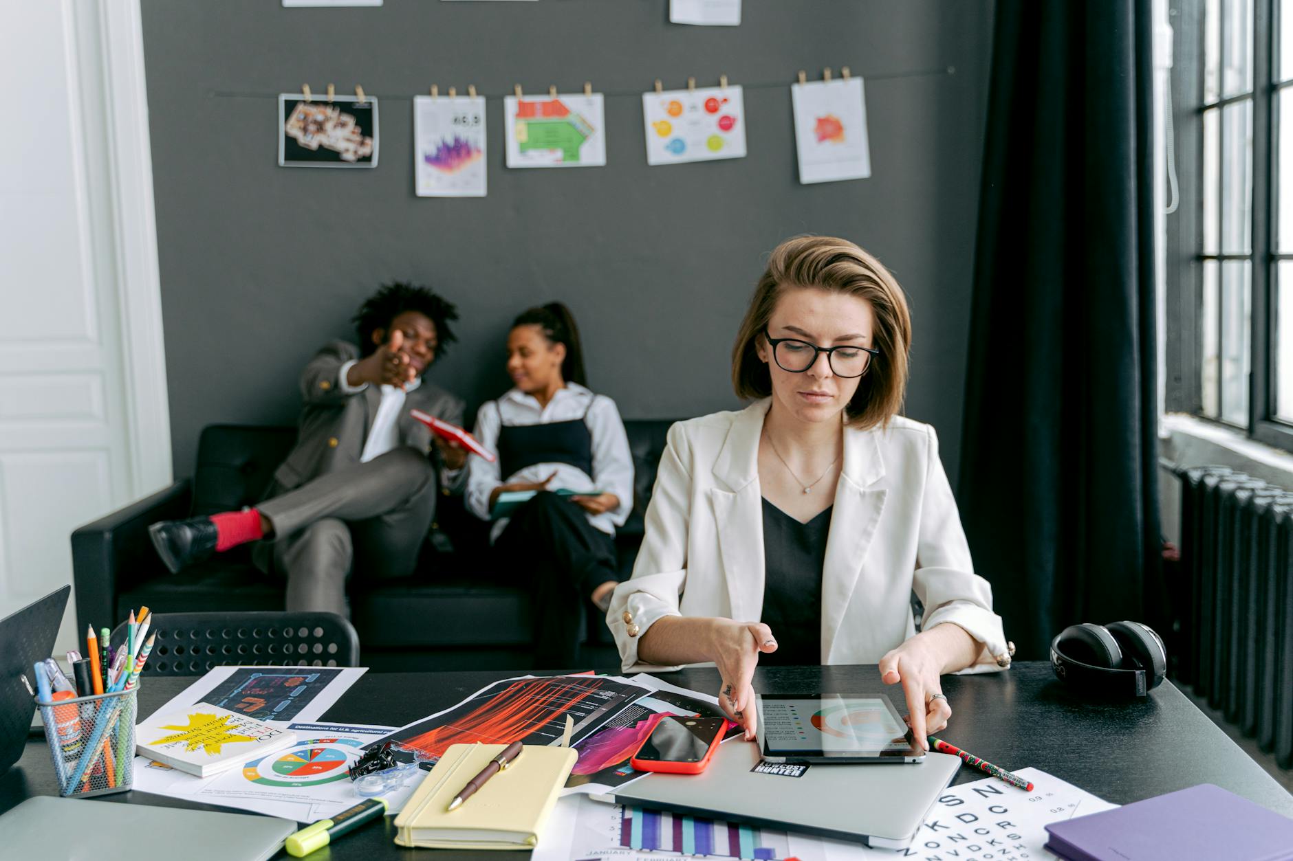 man and women working in office together